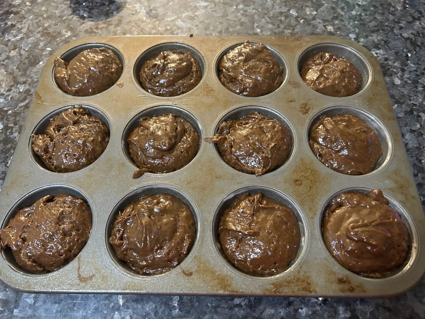 muffin batter in muffin tin