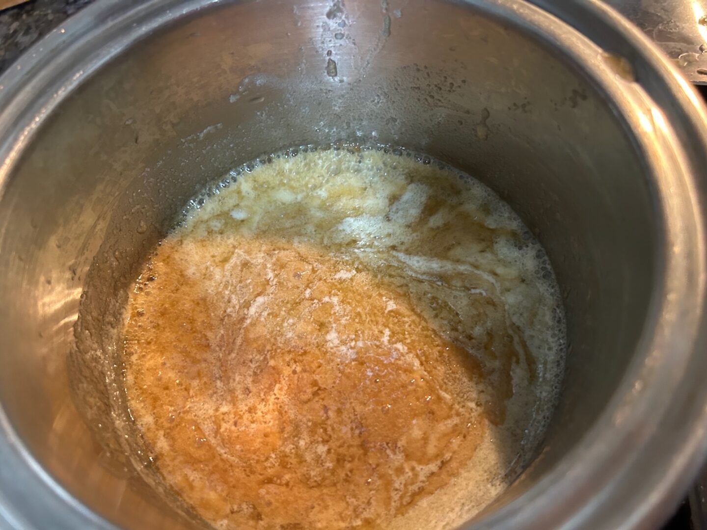 Brown Sugar Buttercream ingredients in saucepan on stove