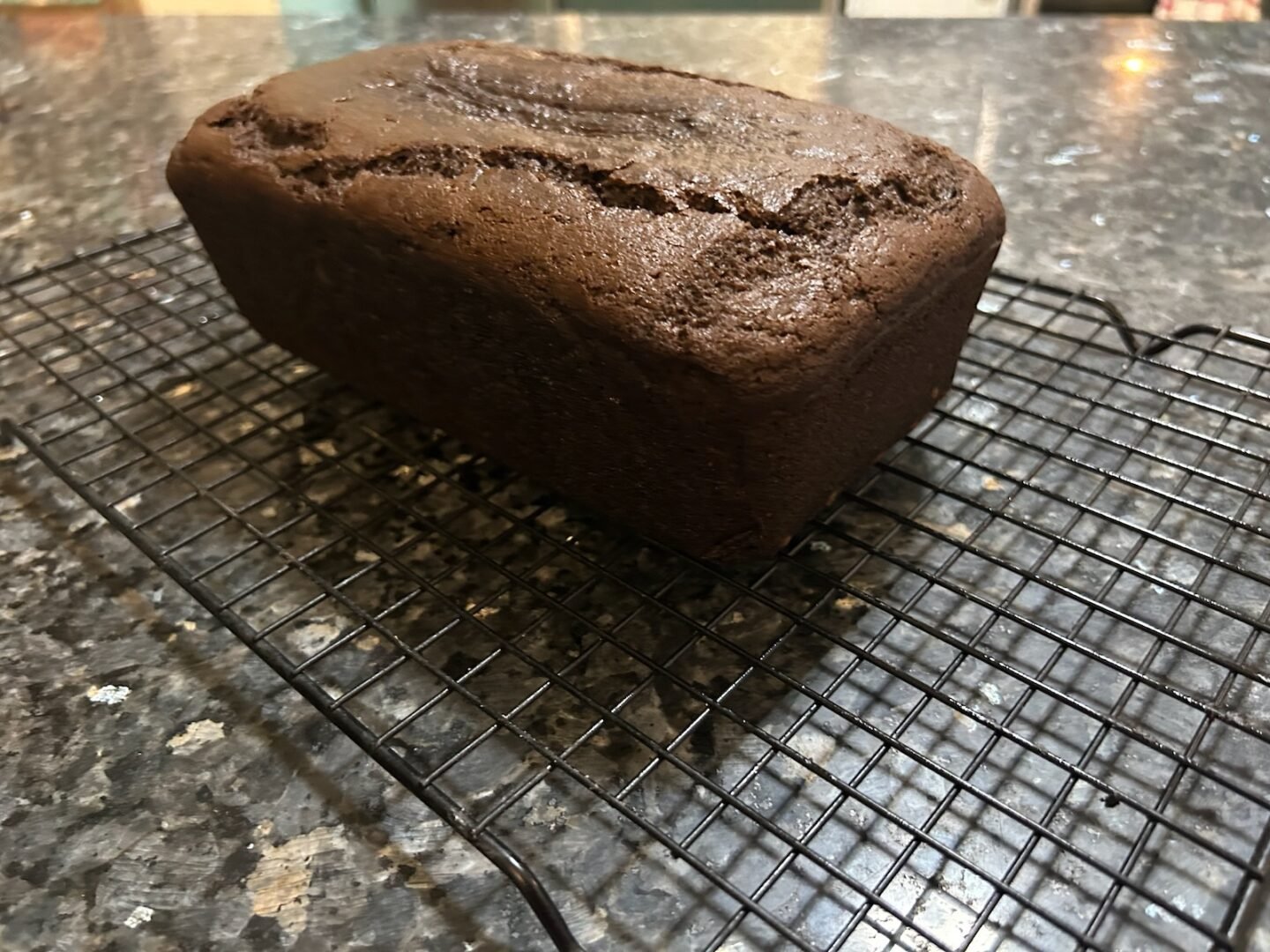 Gingerbread loaf cooling on wire rack