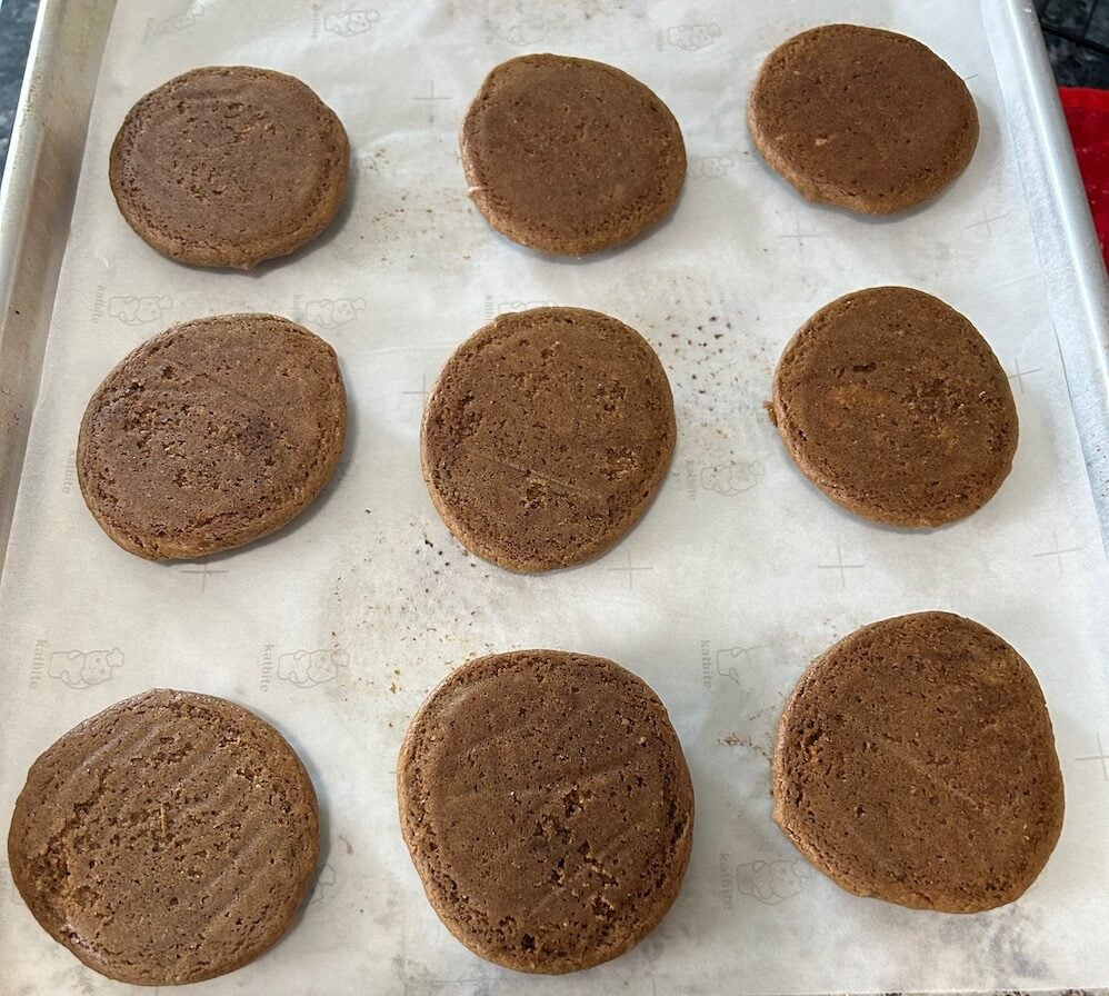 baked gingerbread cookies, upside-down, ready to be filled