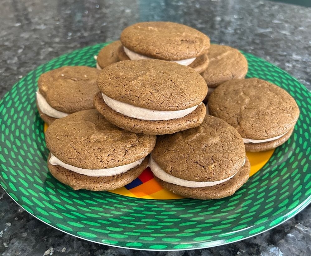 Gingerbread Whoopie Pies stacked on plate