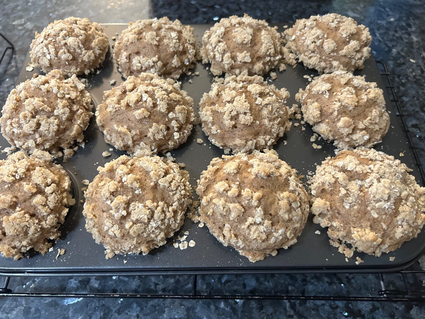 Sweet Potato Muffins with Oat Streusel Topping cooling in muffin pan