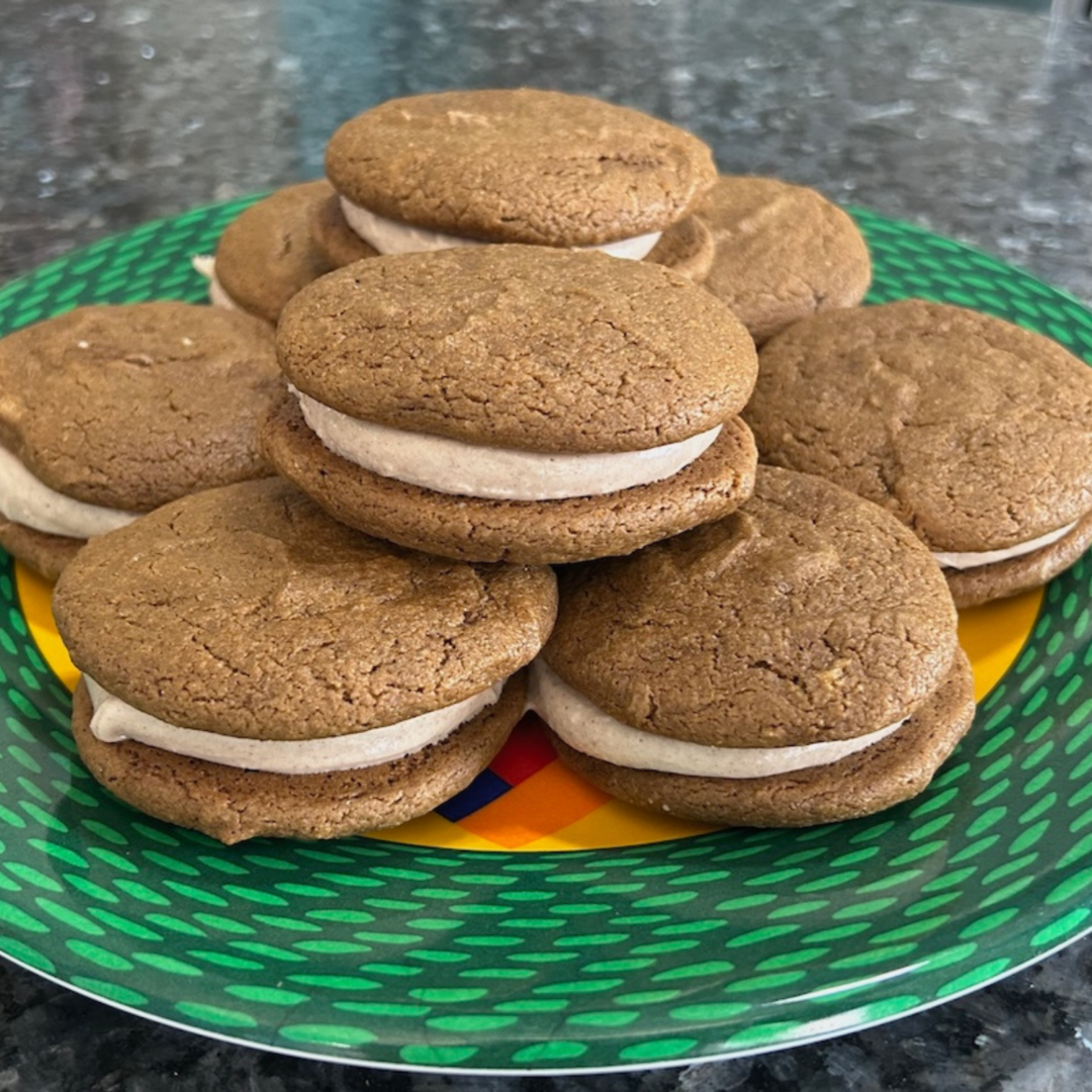 Gingerbread Whoopie Pies stacked on plate
