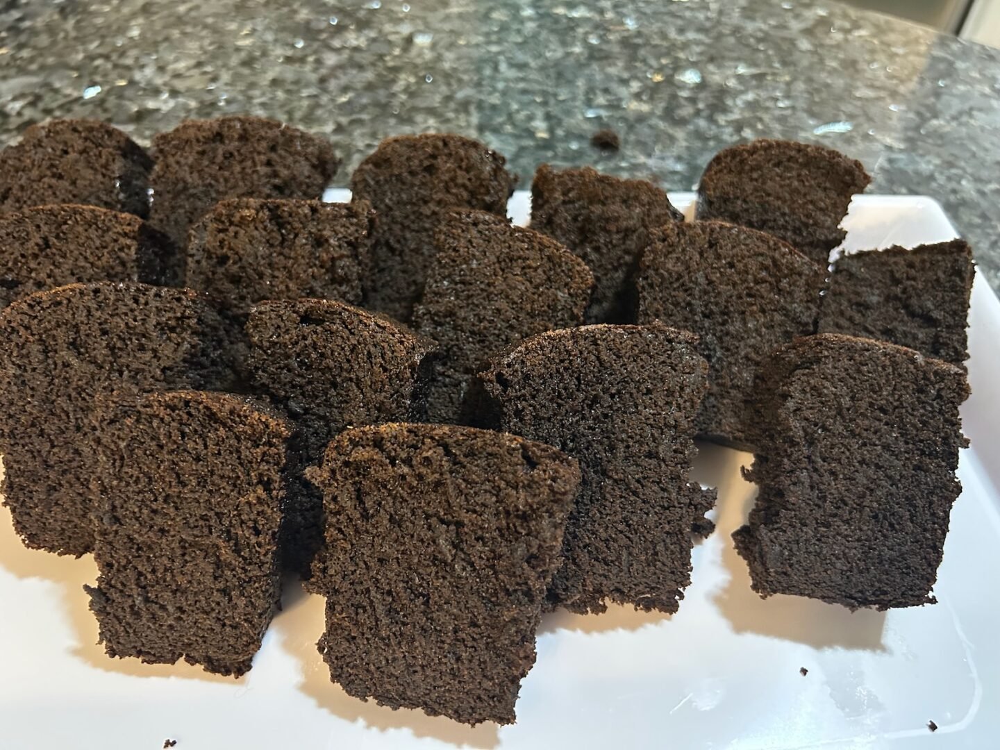 Jamaican Sticky Gingerbread sliced into pieces, ready to serve