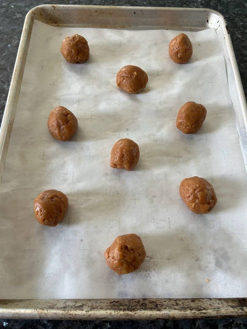 low carb peanut butter cookie dough balls on baking tray
