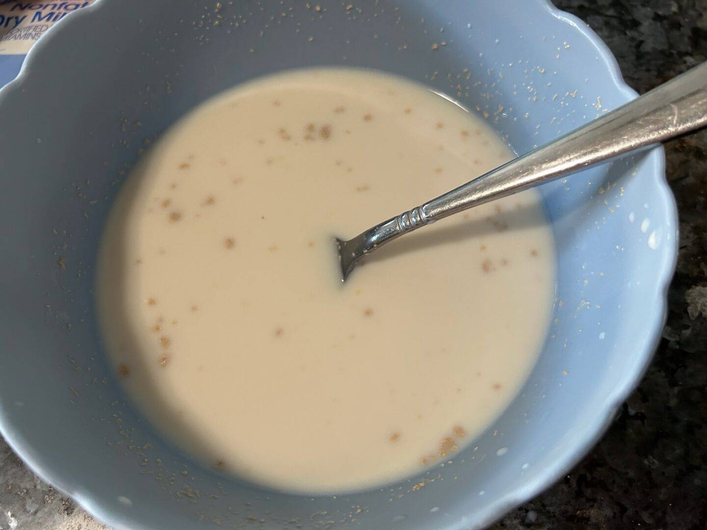 milk and yeast in bowl