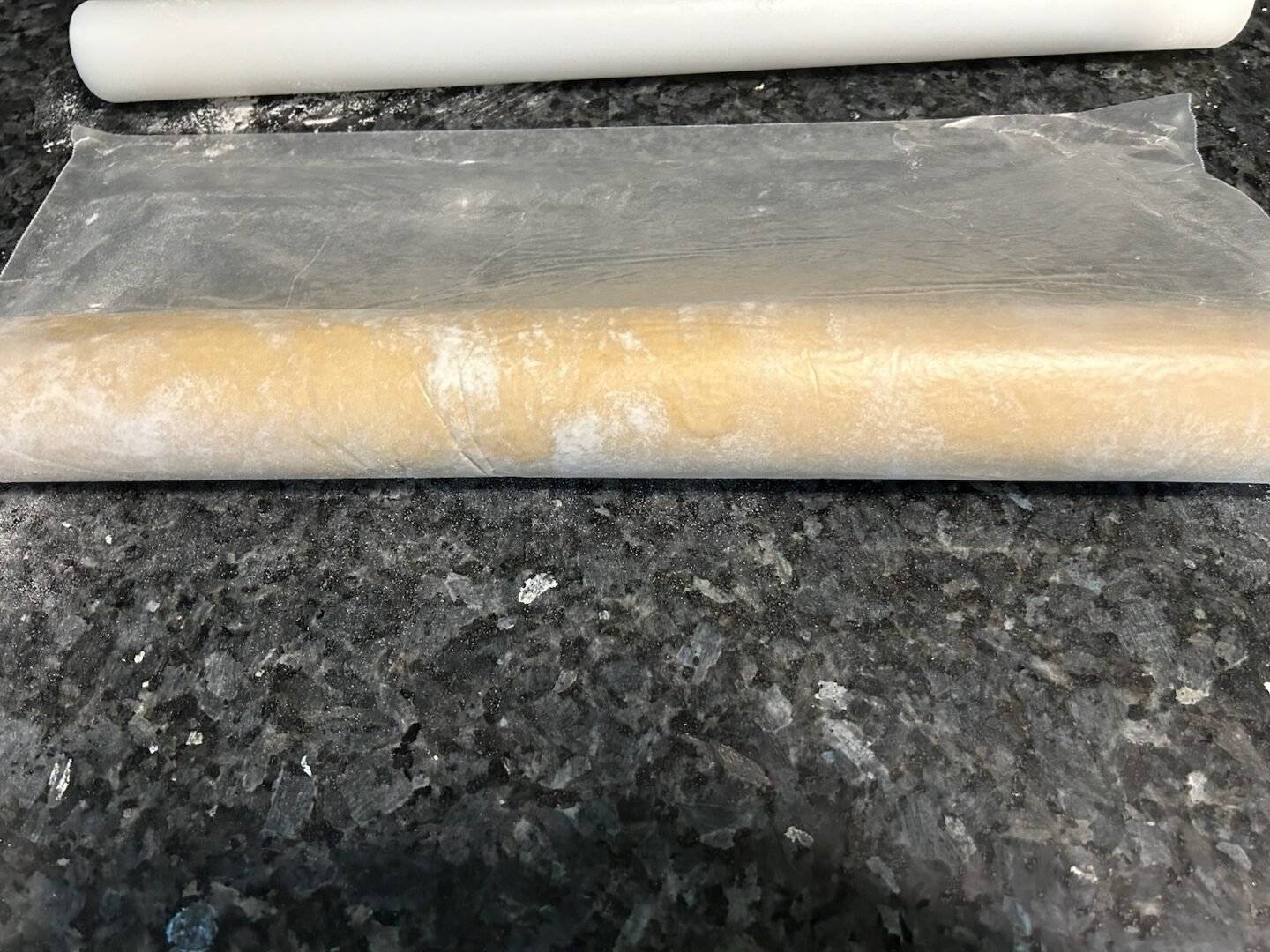 rolling cinnamon rolls into a log