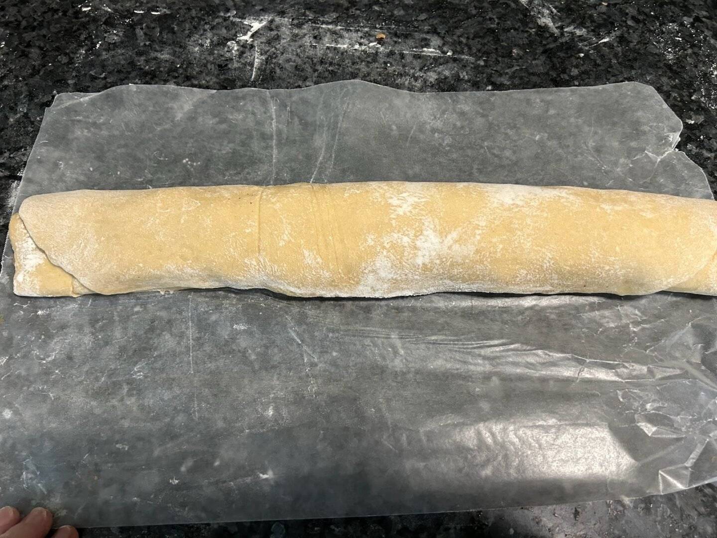 log of cinnamon rolls before cooking