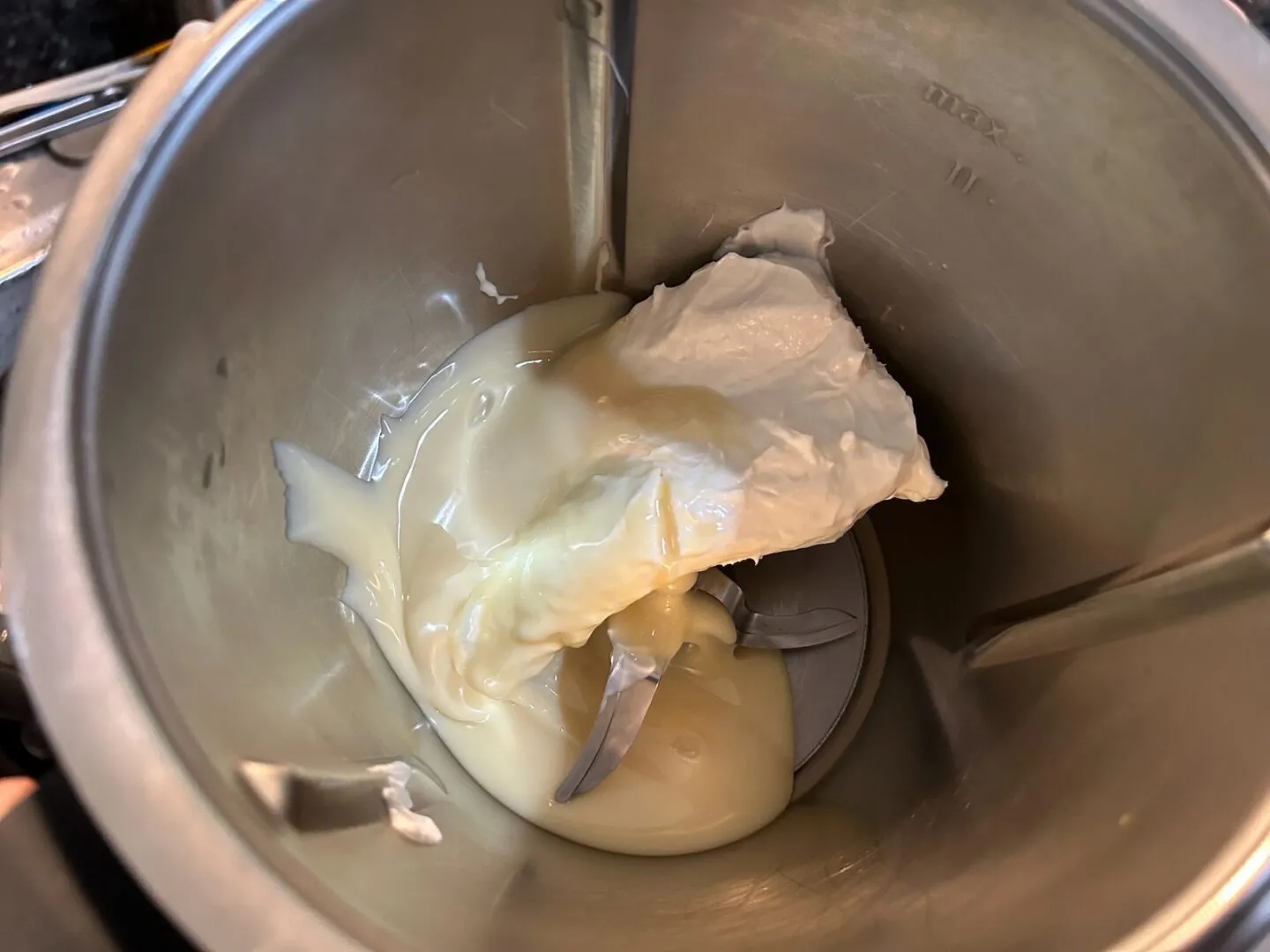 cream cheese and sweetened condensed milk in mixer
