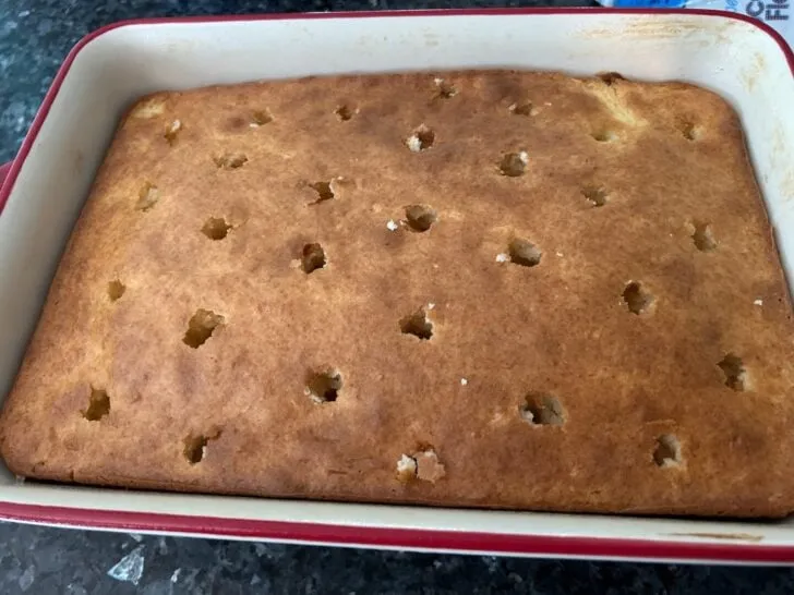 Strawberry Coconut Poke Cake (poked with holes)