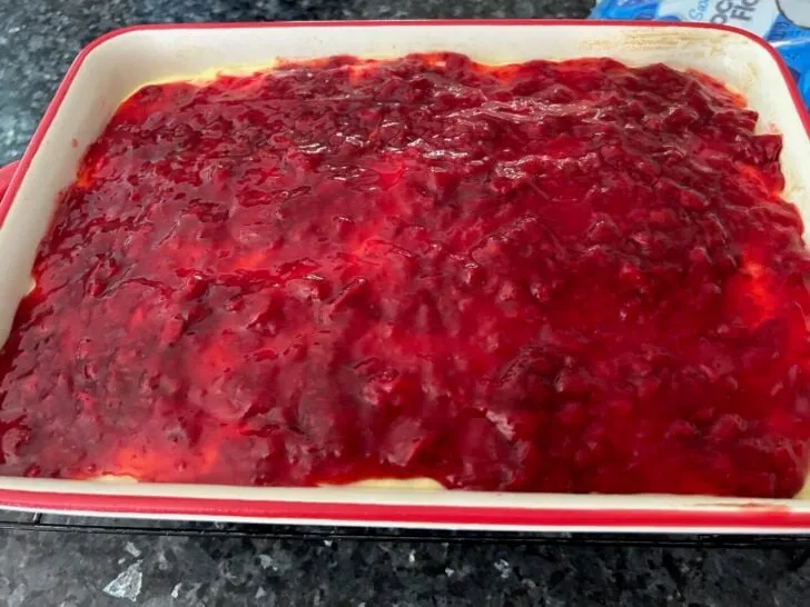 cake with berry pie filling on top