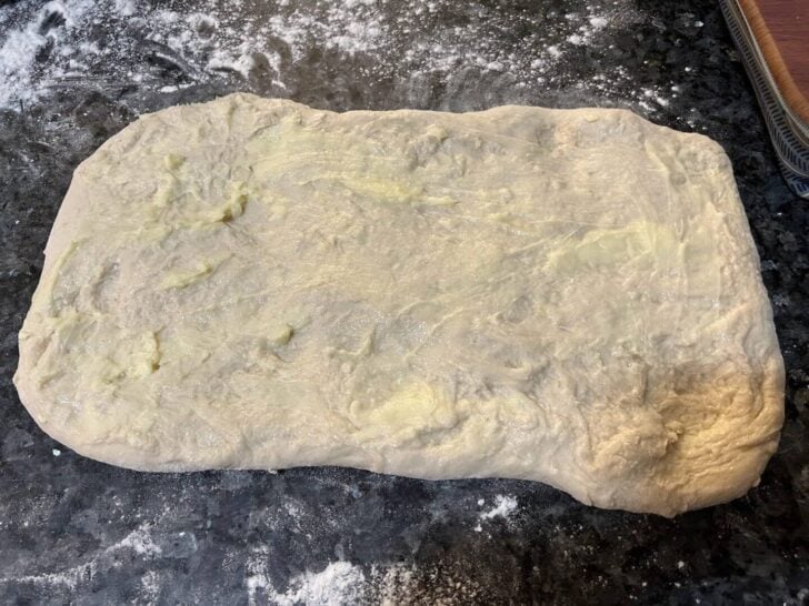 buttered dough rolled into rectangle