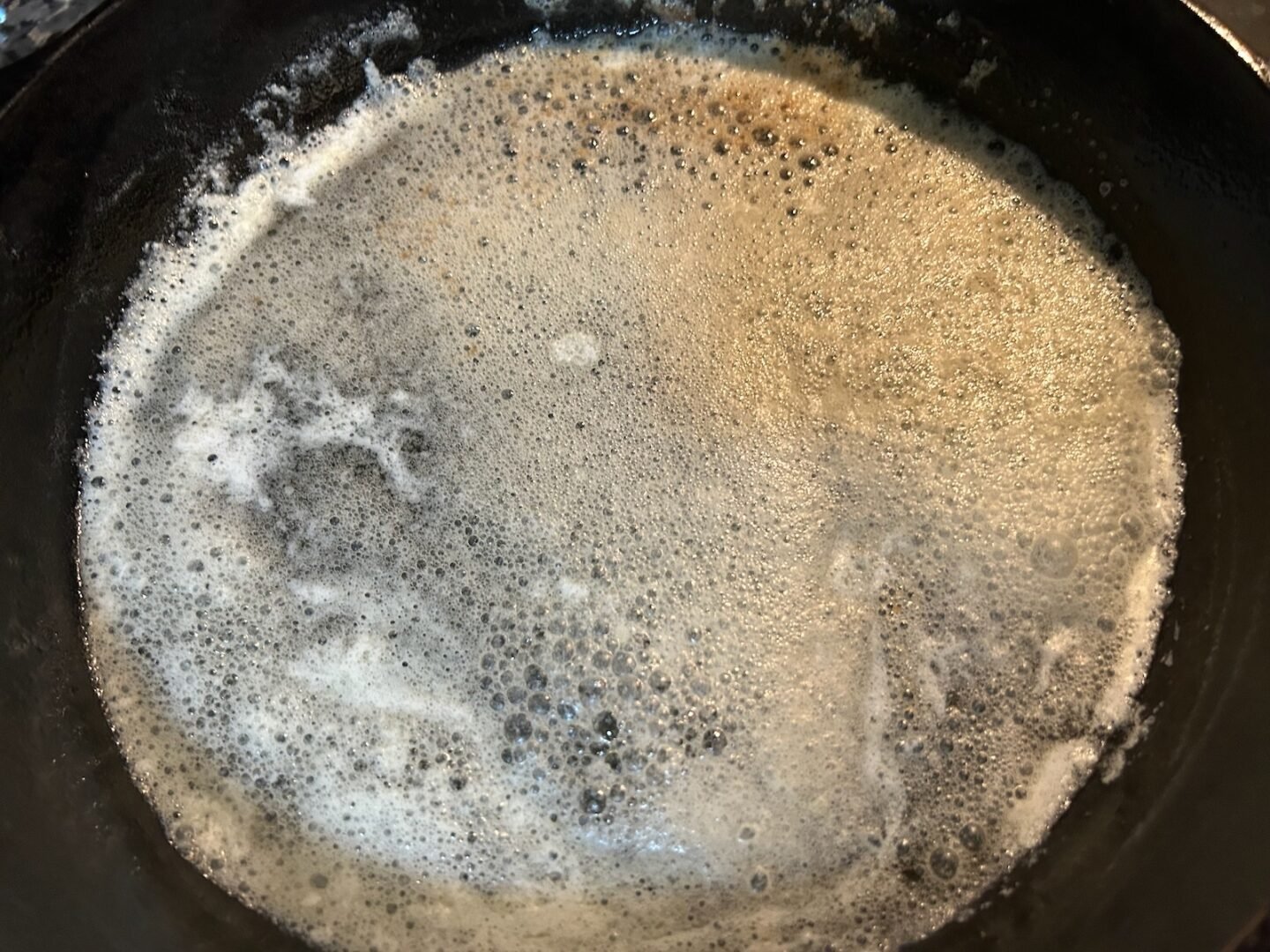 melted butter in cast iron skillet