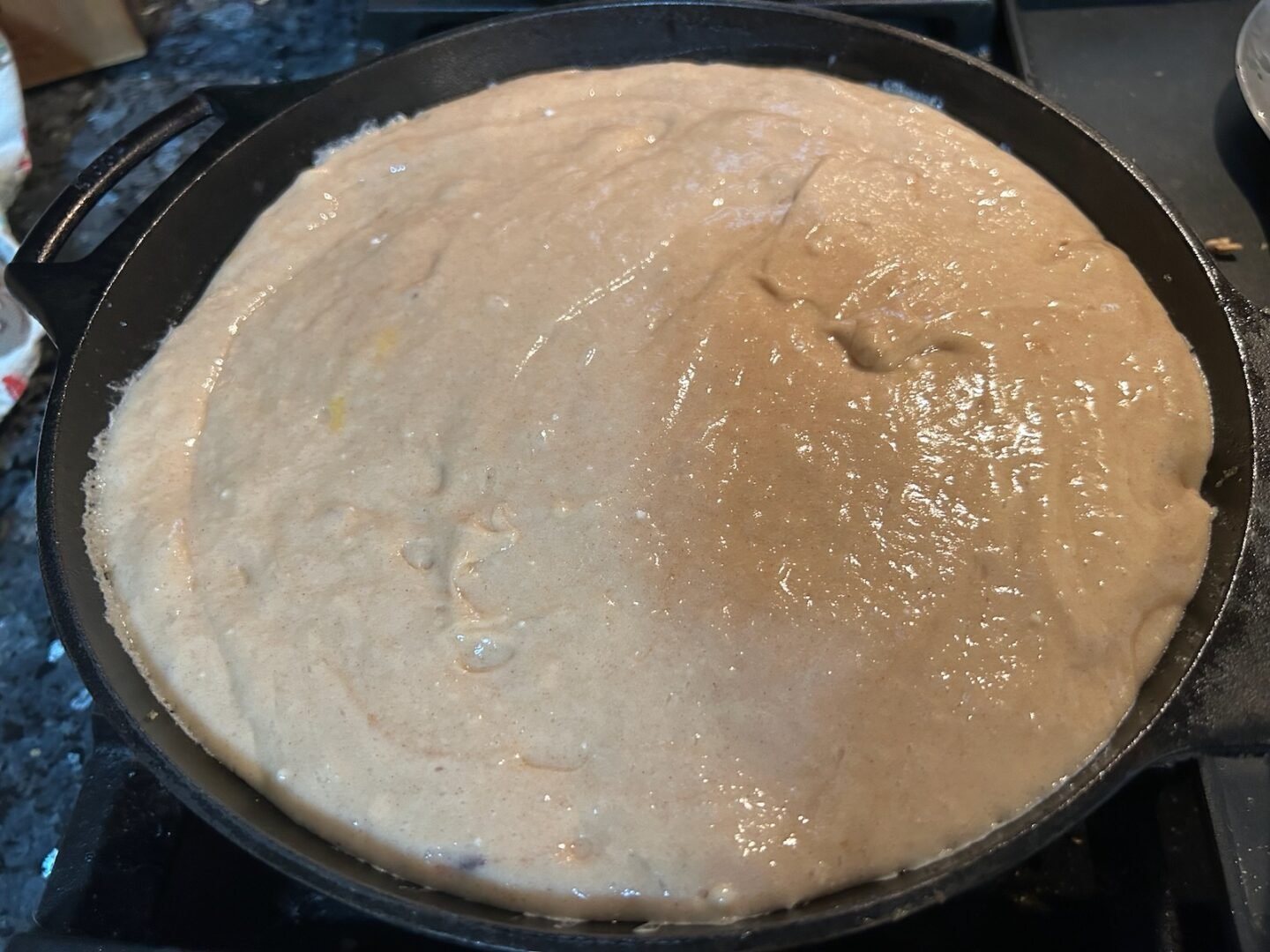 easy apple upside down cake batter in pan