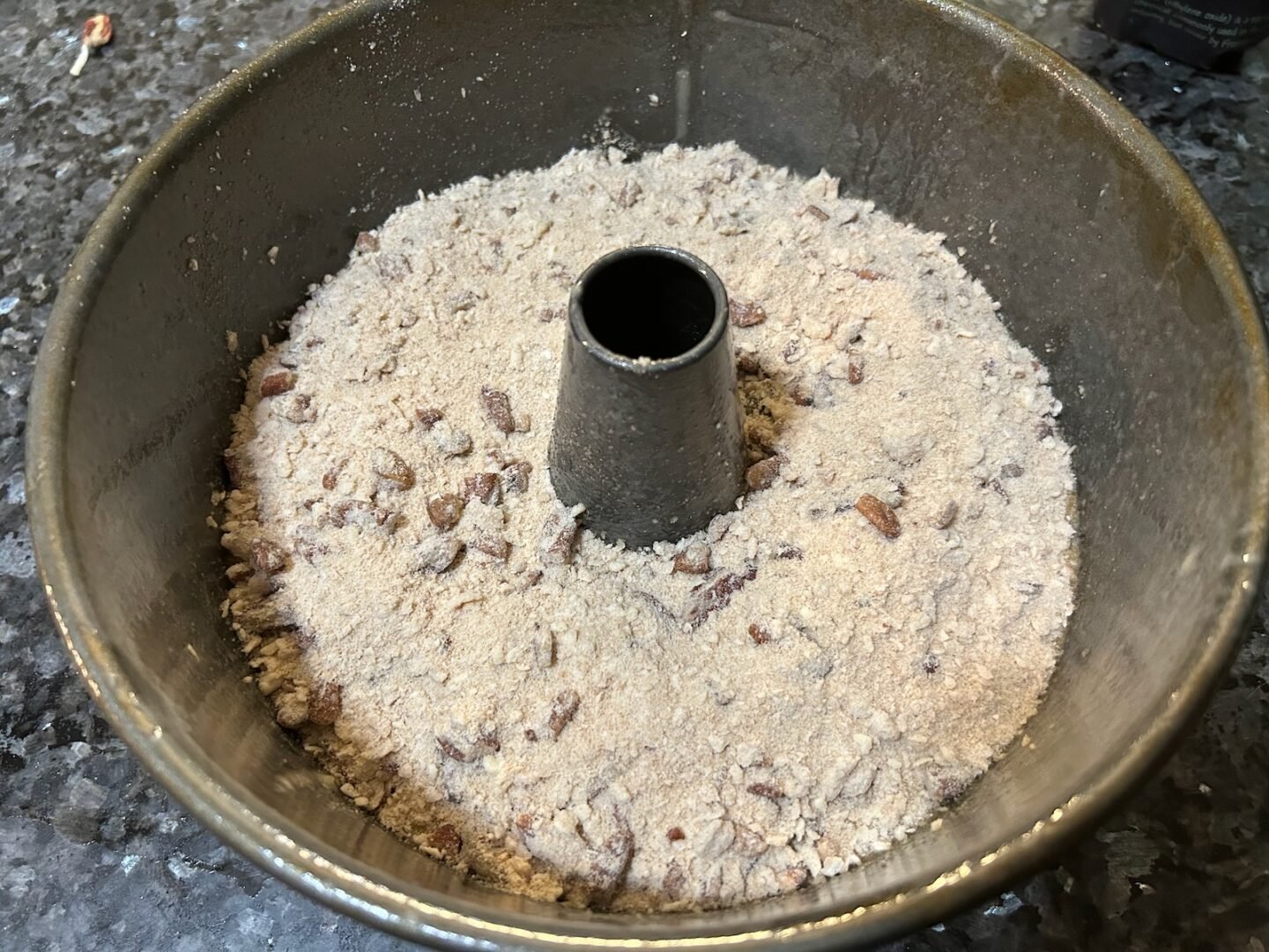 banana bread batter with streusel topping in pan
