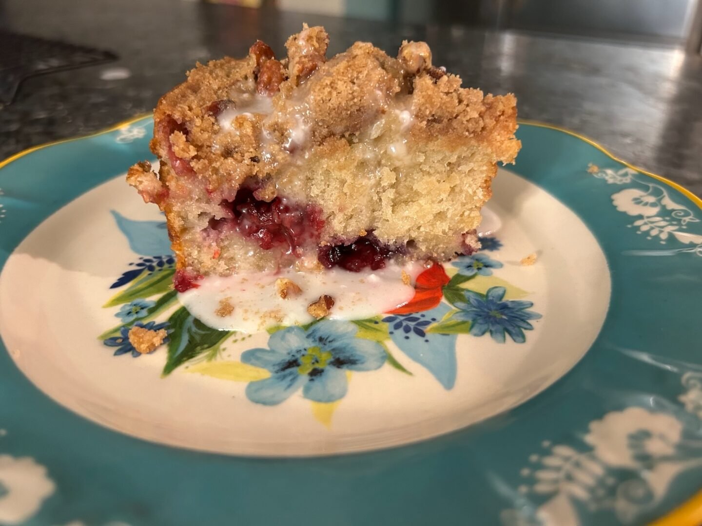 serving of banana bread on plate with glaze