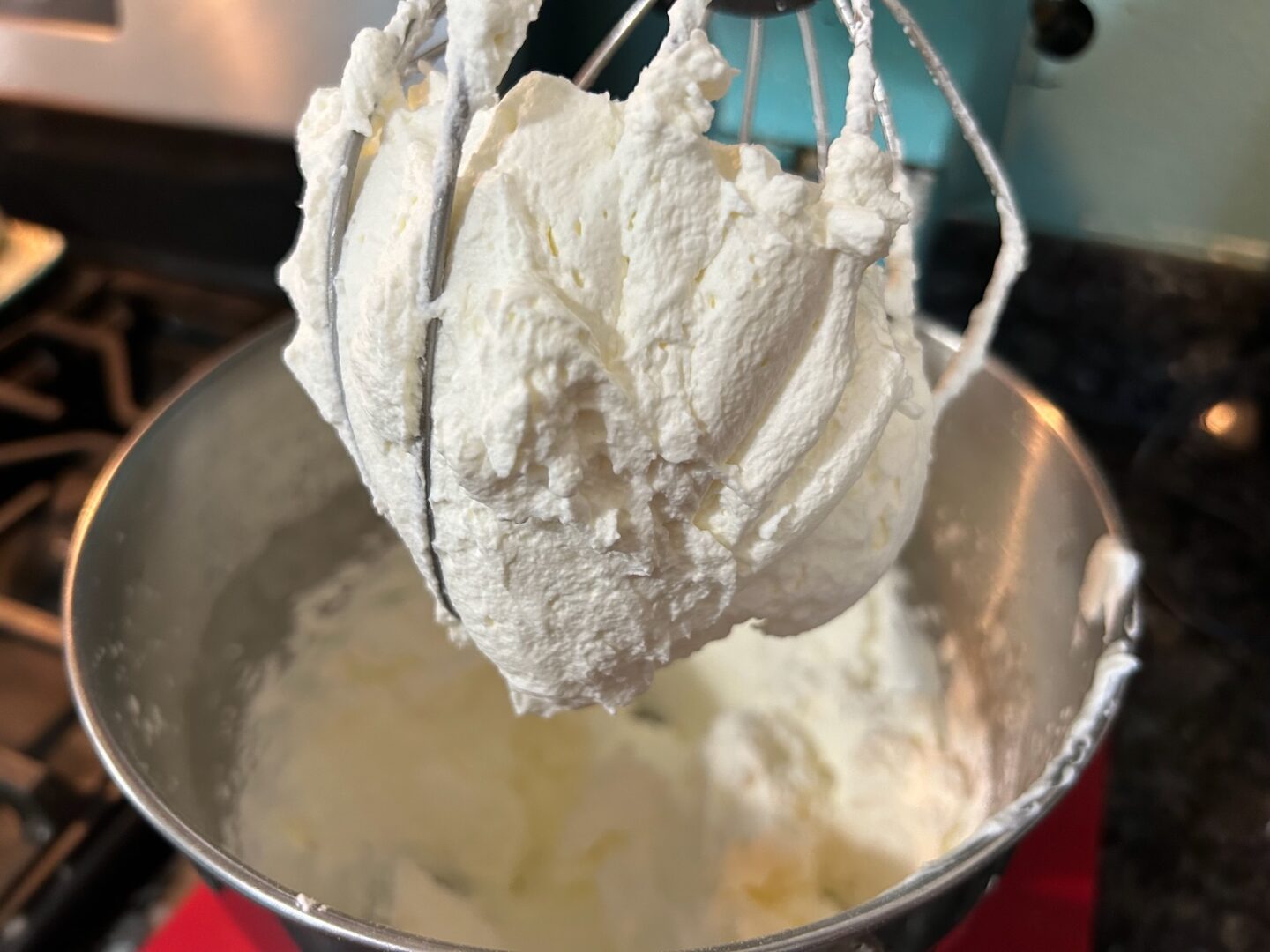 whipped cream in mixing bowl