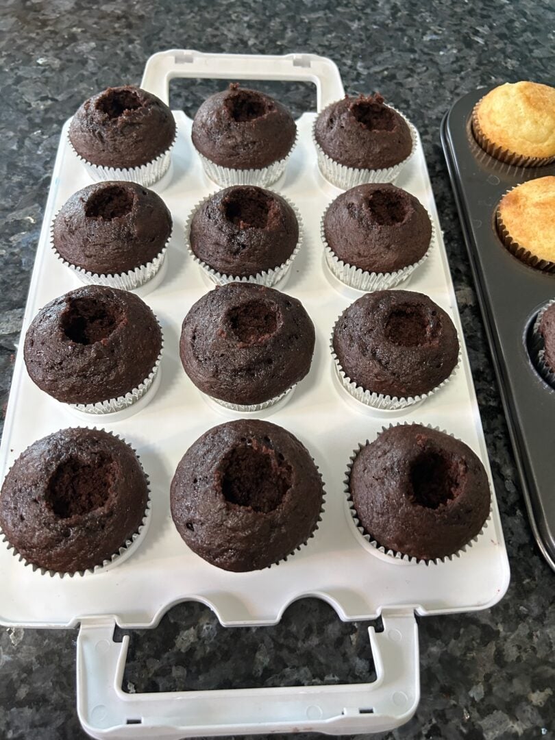 hot cocoa cupcakes, baked, with centers holed out