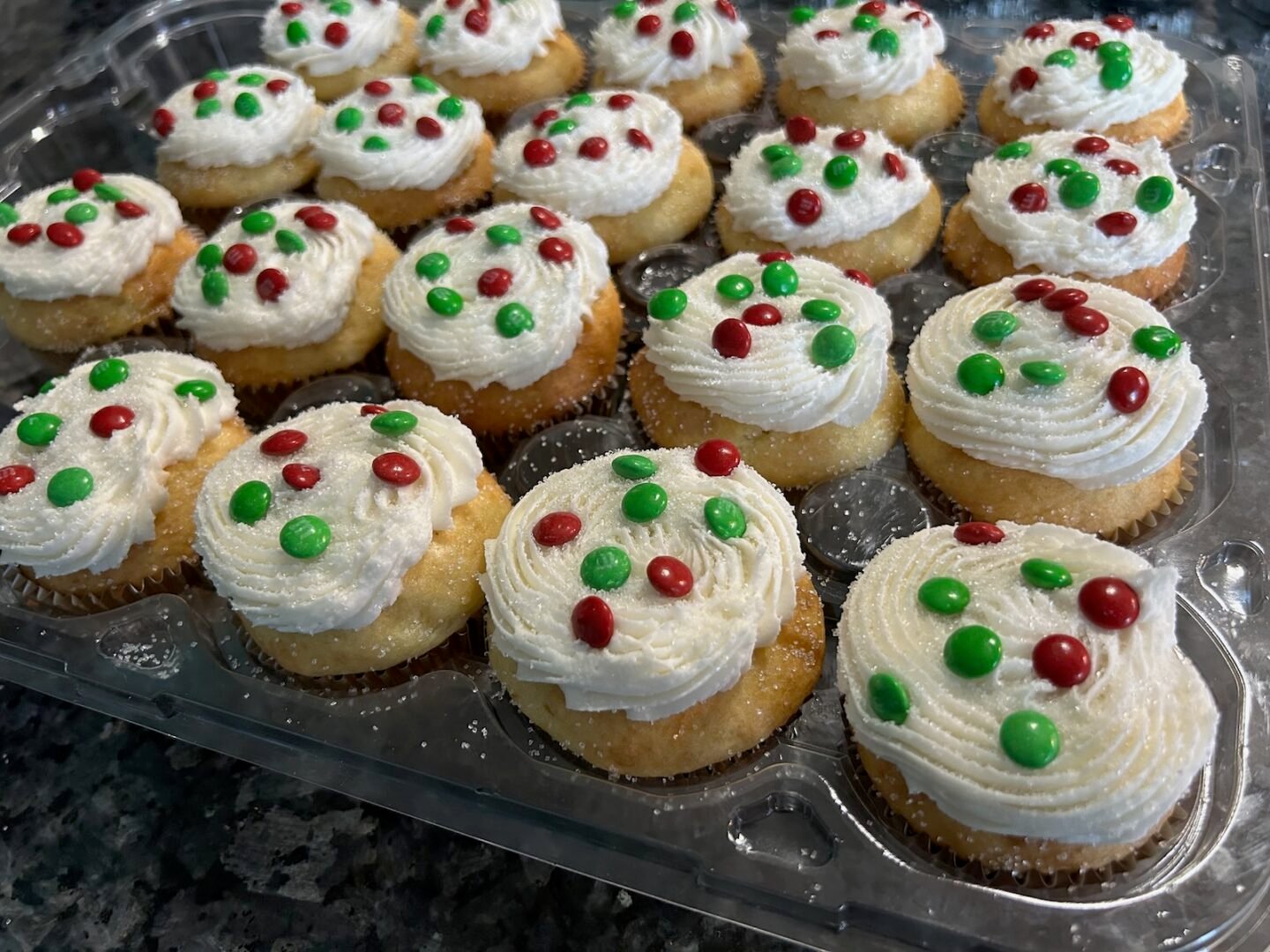 sugar cookie cupcakes decorated with mini Christmas M&Ms