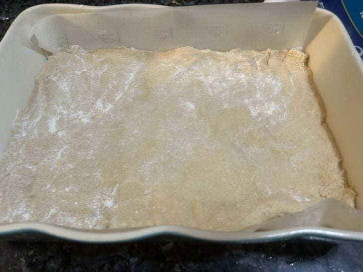 pecan pie snickerdoodle bar dough in pan