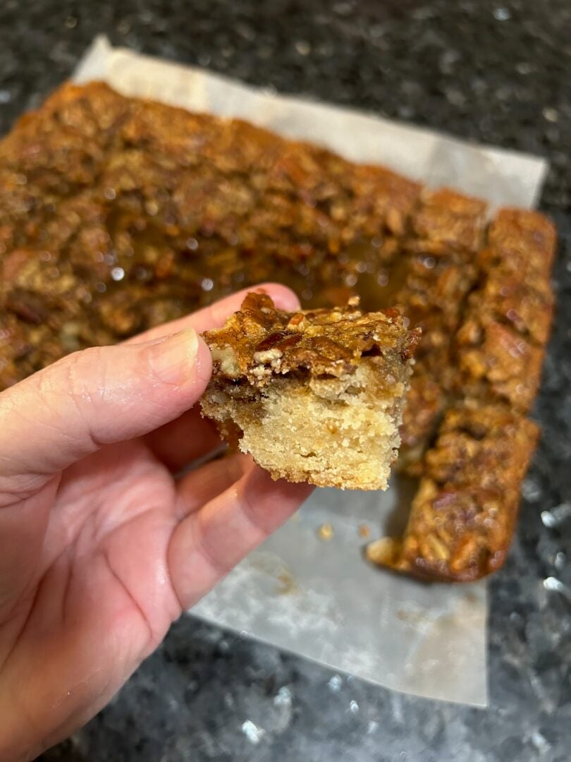 pecan pie snickerdoodle bars, cut, flaky interior showing