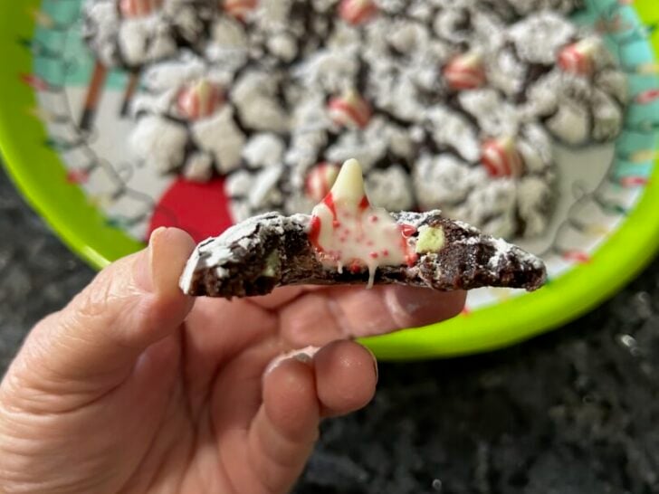 interior view of peppermint brownie kiss cookie with peppermint kiss melting in the middle