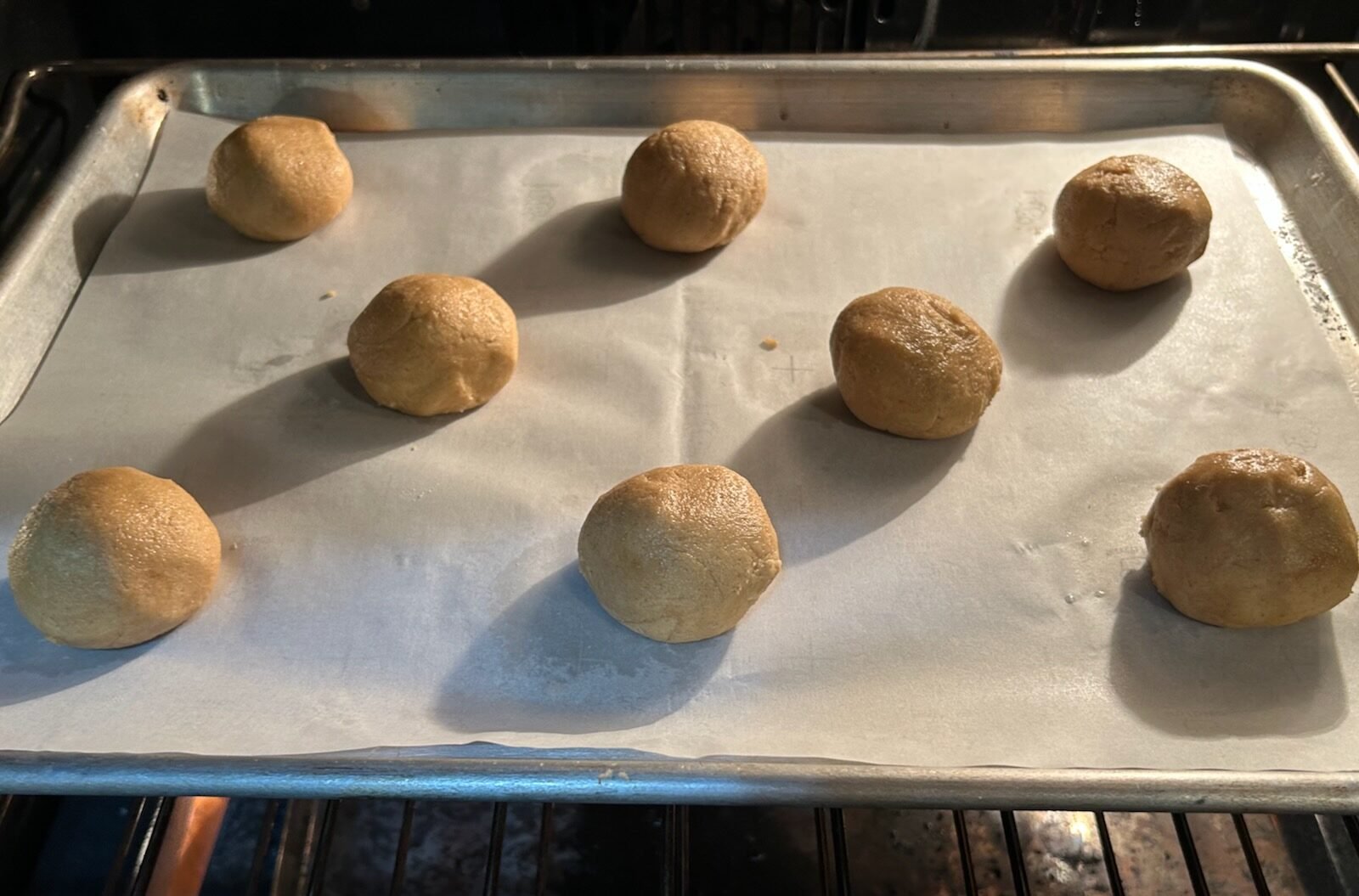 fluffernutter dough balls on tray in oven
