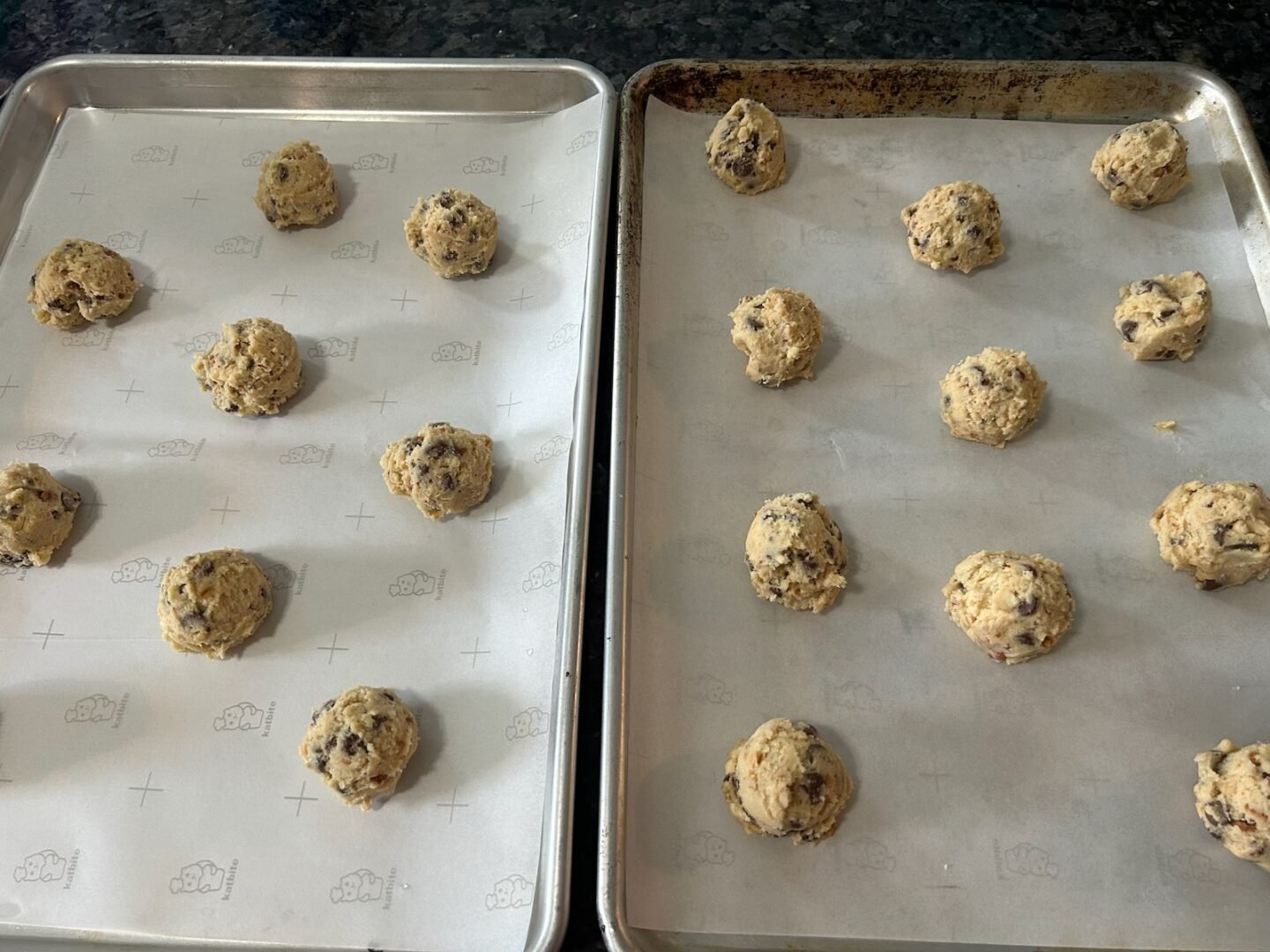 Spanish Peanut Chocolate Chip Cookie dough balls on baking sheets