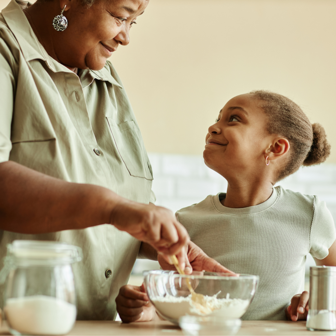 girl baking with grandmother