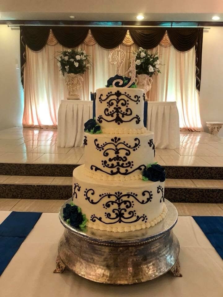 elegant wedding cake with black scrolling