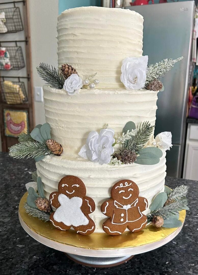 christmas wedding cake with gingerbread man and woman