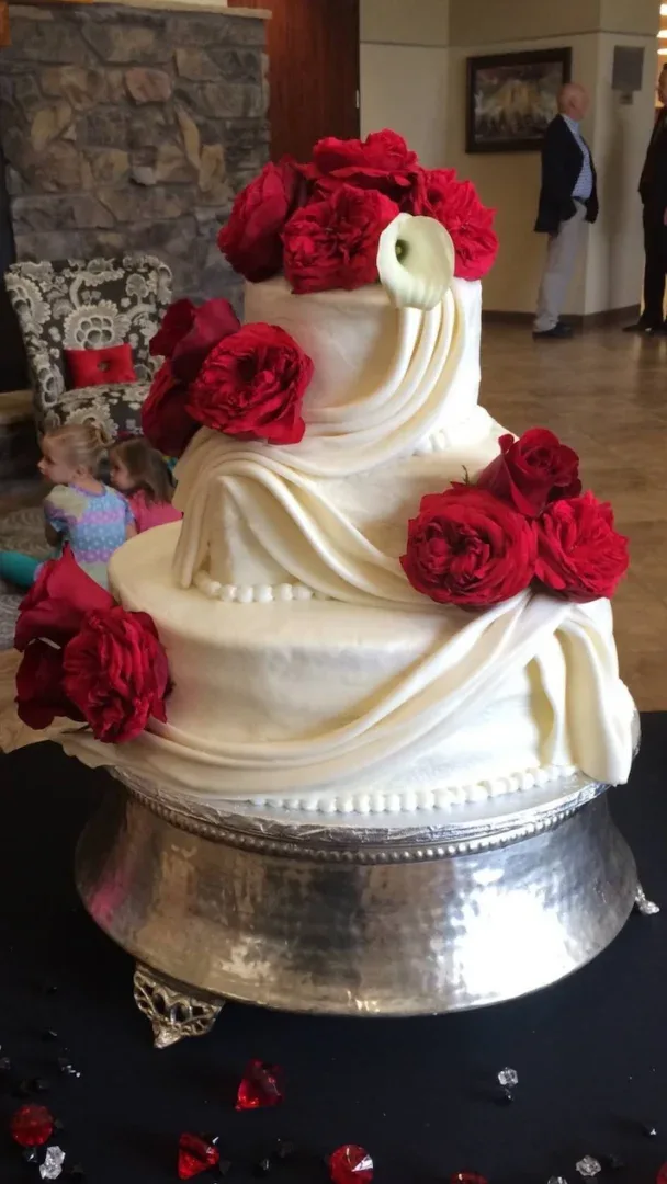 elegant formal wedding cake with red roses
