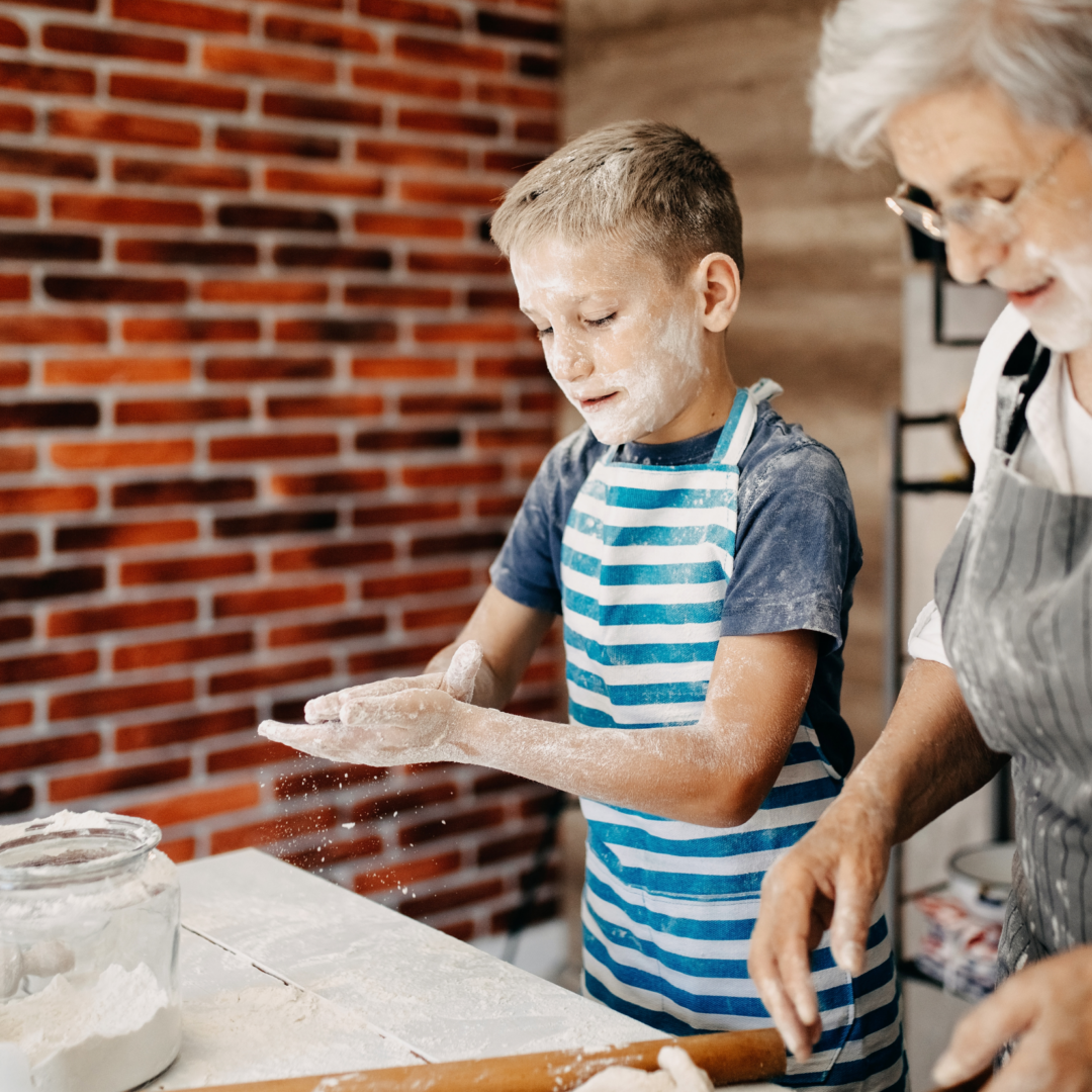 boy baking bread with grandmother