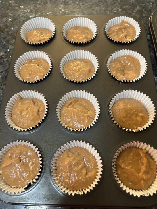 banana churro muffin batter in cupcake liners, ready to bake