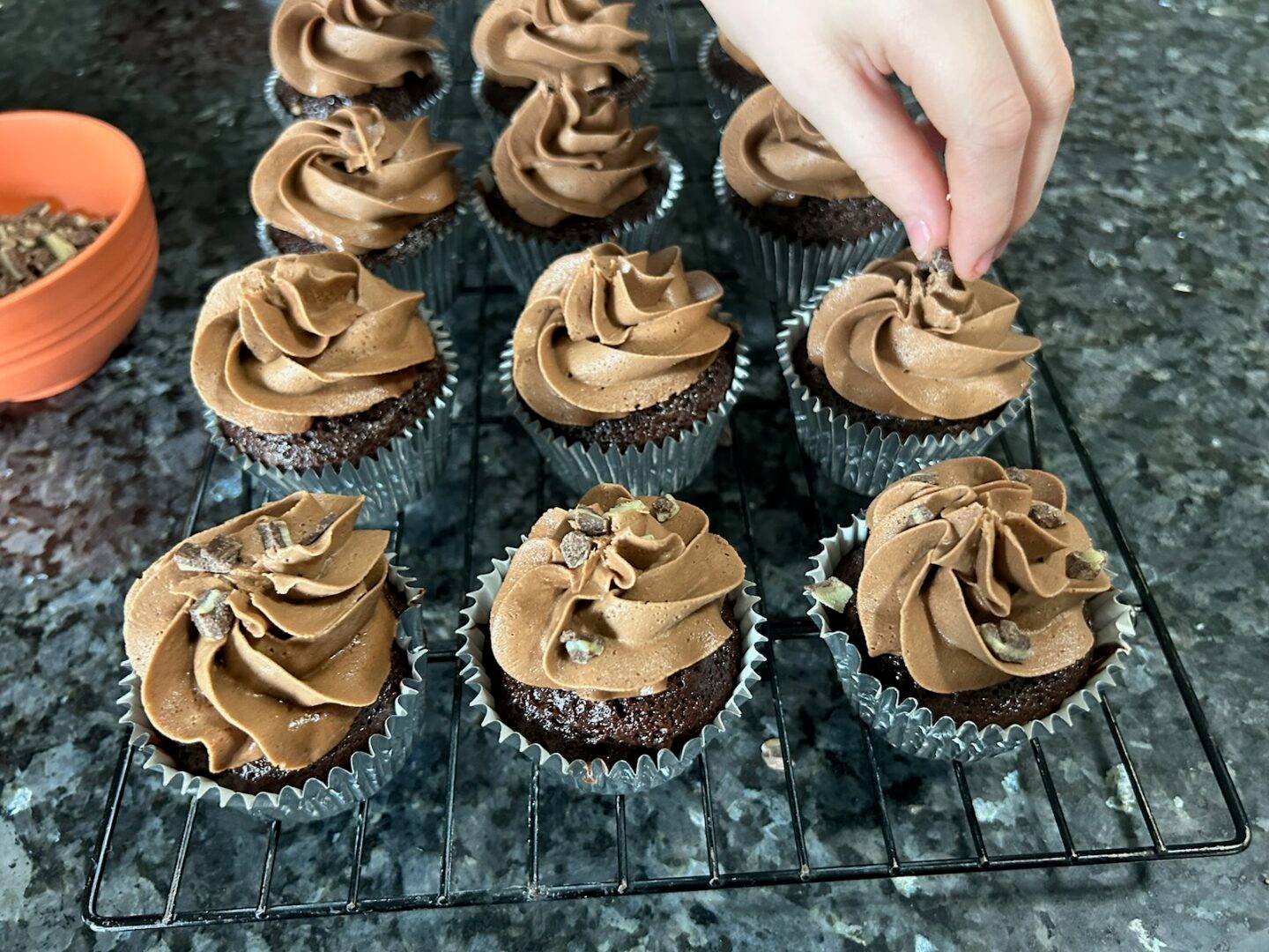 chocolate cupcakes with chocolate frosting, andes mint chips on top