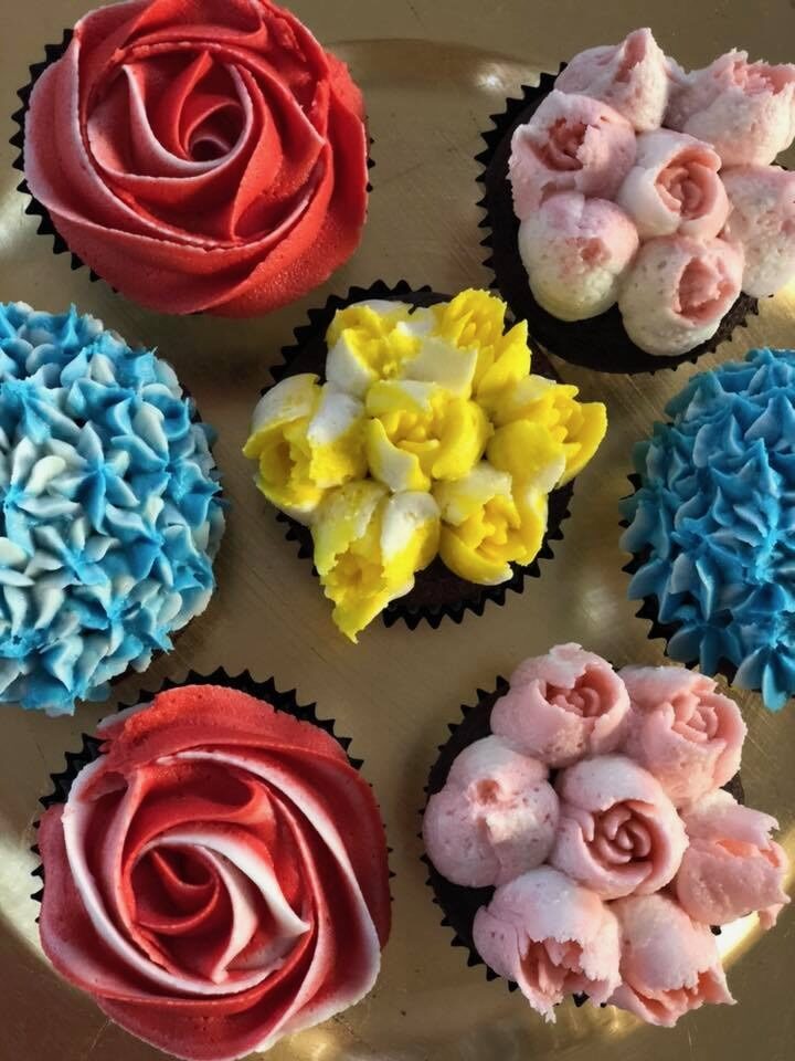 cupcake with buttercream frosting designed like flowers