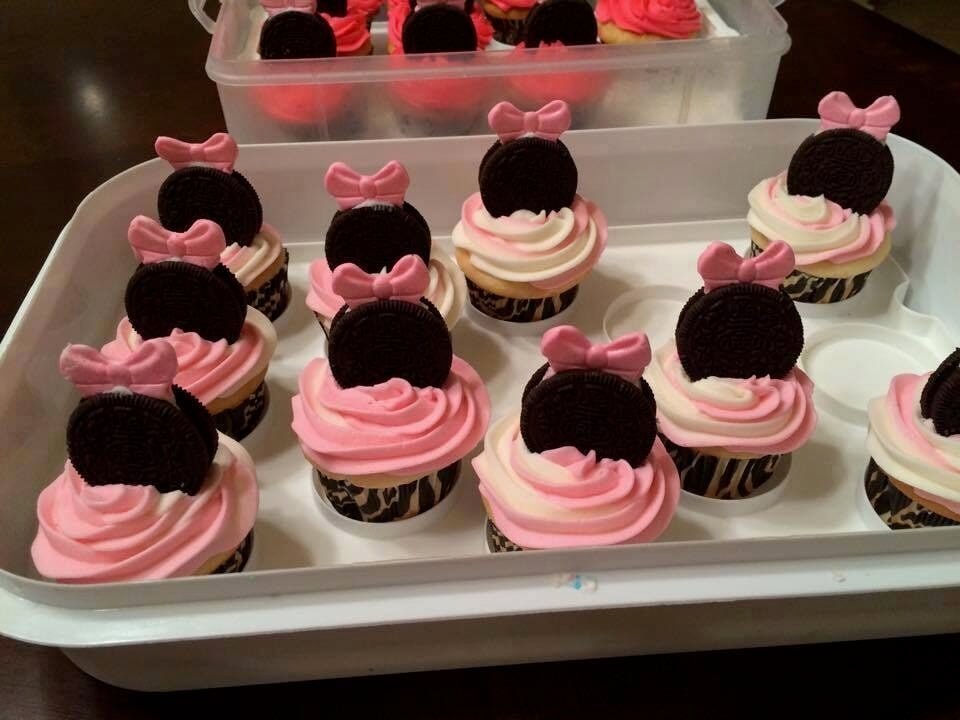 Minnie Mouse cupcakes in pink frosting with an oreo topping 