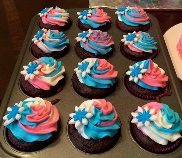 pink, white, and teal frosted cupcakes for baby shower