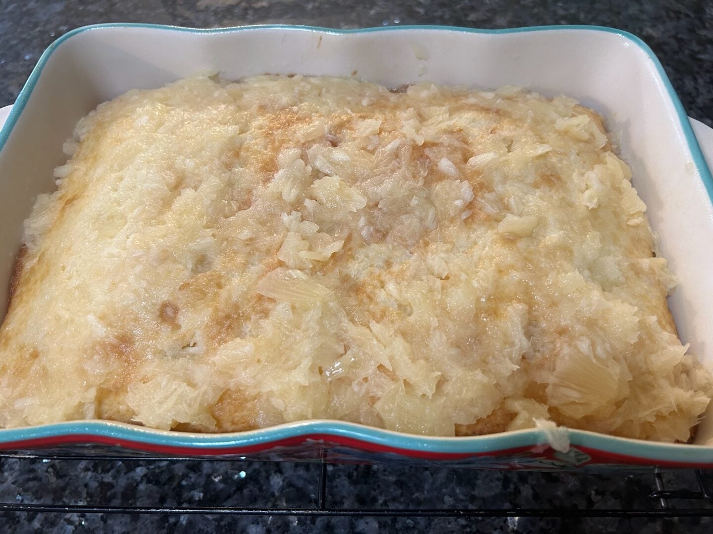 crushed pineapple poured over warm cake