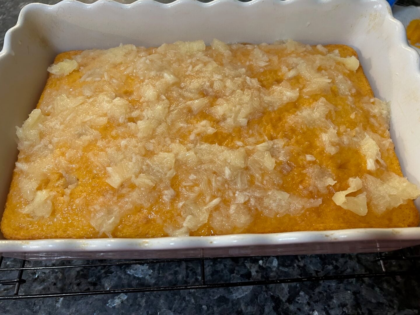 crushed pineapple on top of baked orange cake