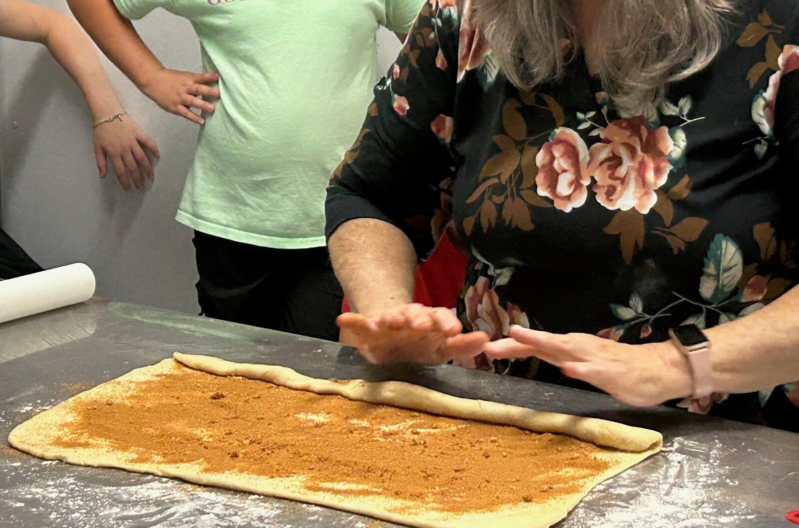 Homemade Honey Buns dough being rolled into log