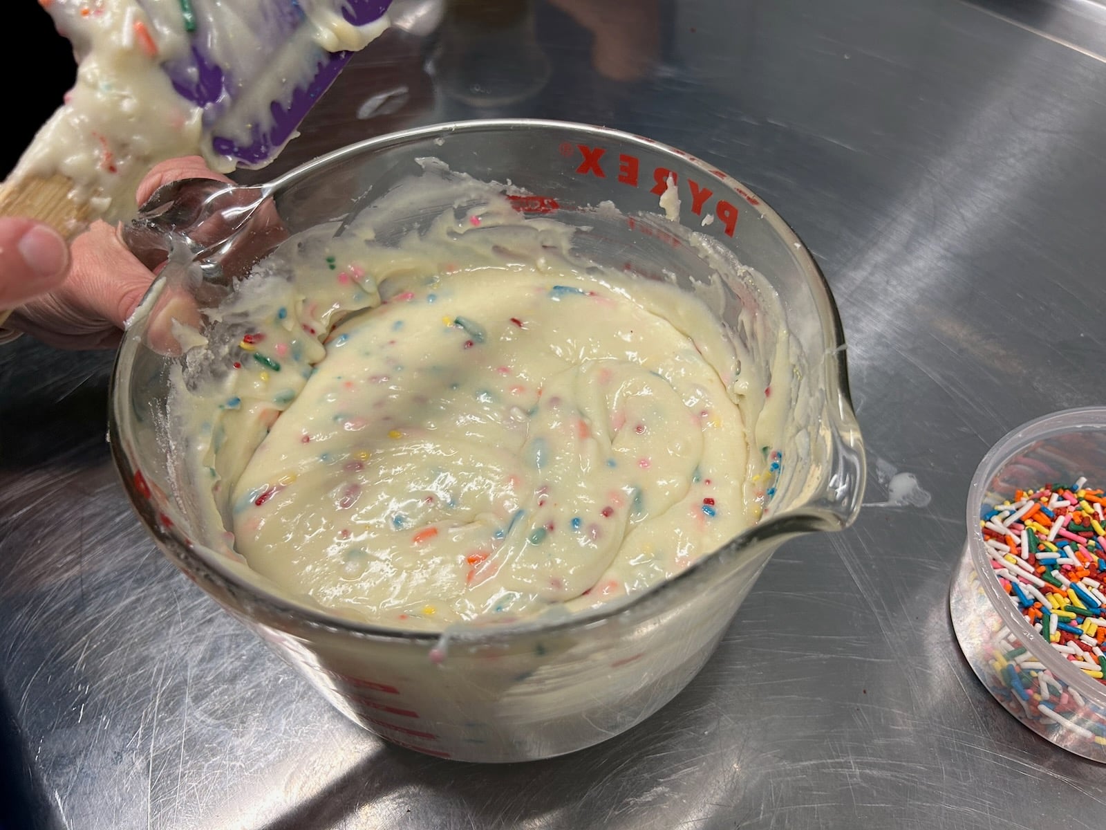 birthday cake fudge batter in bowl, sprinkles folded in