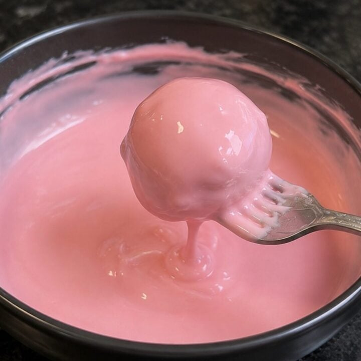 cake ball dipped in pink melting chocolate
