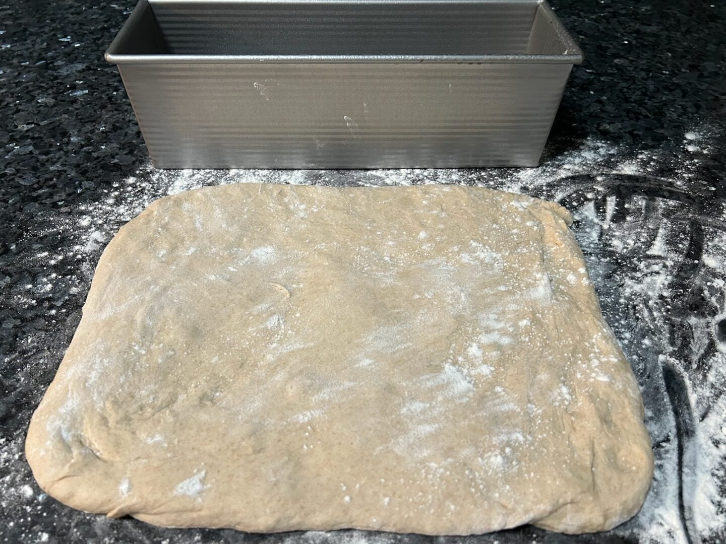 simple sandwich bread dough pressed into rectangle