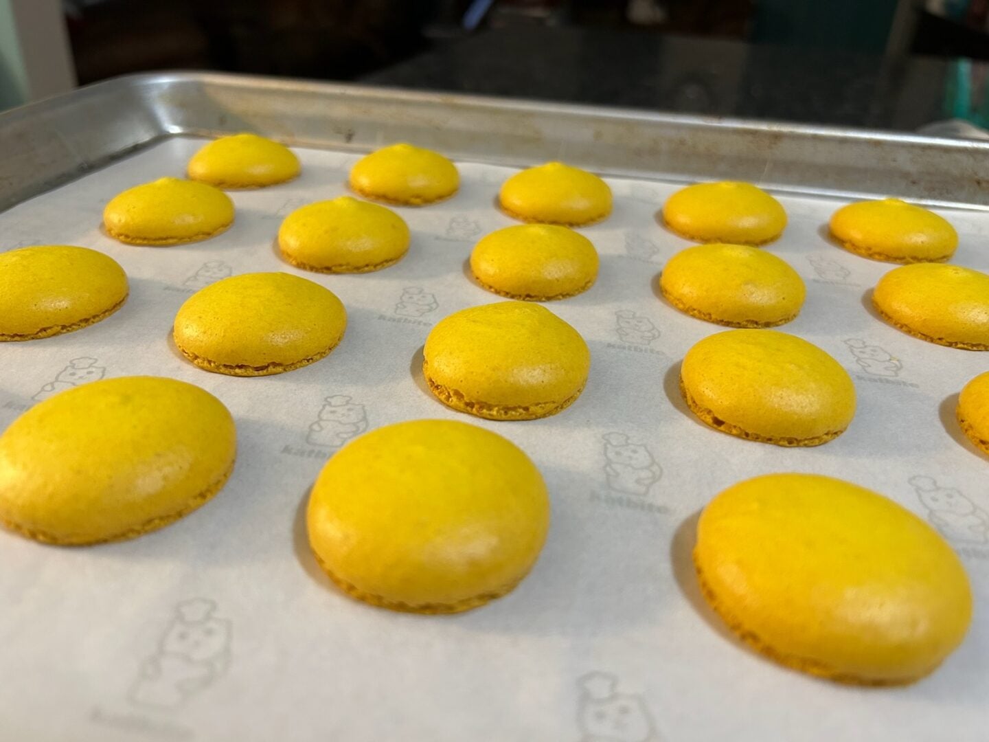 freshly baked macaron shells with lovely feet