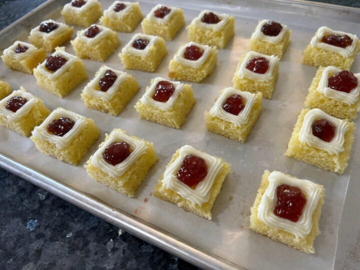 dollop of strawberry preserves in center of lemon cake squares
