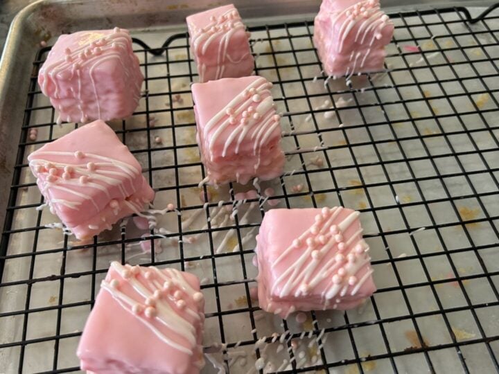 simple cake mix petit fours in pale pink with drizzle and edible pearls