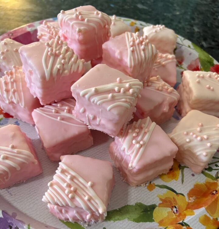 simple cake mix petit fours in pale pink with drizzle and edible pearls