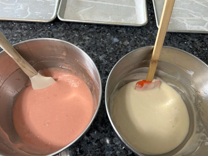 cake batters, pink and white, in two bowls