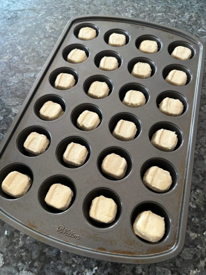 sugar cookie dough bas in muffin pan
